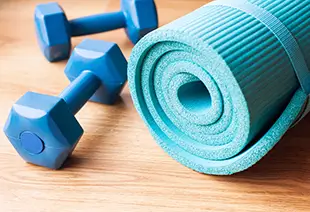 Dumbells and yoga mat