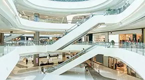 Escalator in hall of shopping mall