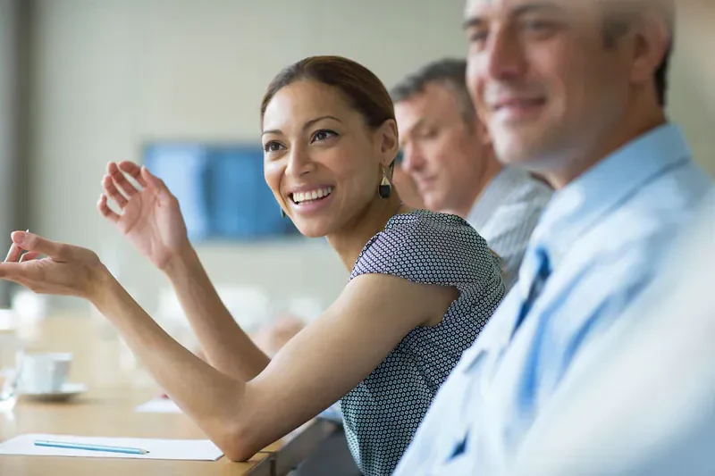 Woman speaking at a business meeting.