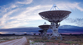Satellite dishes spread out across open land