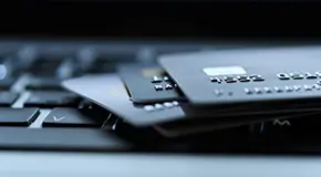 Close up of credit cards on a laptop computer